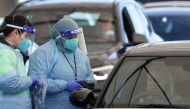 Medical workers administer tests at the Bondi Beach drive-through coronavirus disease (COVID-19) testing centre in the wake of new positive cases in Sydney, Australia, June 17, 2021. REUTERS/Loren Elliott/File Photo
