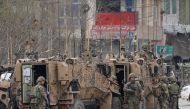 NATO soldiers inspect near the site of an attack in Kabul, Afghanistan March 25, 2020. Reuters/Mohammad Ismail/File Photo