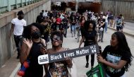 People march as they celebrate Juneteenth, which commemorates the end of slavery in Texas, two years after the 1863 Emancipation Proclamation freed slaves elsewhere in the United States, in Washington, D.C. U.S., June 19, 2021. REUTERS/Ken Cedeno
