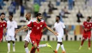 Oman player Salaah Al Yahyaei  celebrates scoring a goal against Somalia in Doha yesterday.