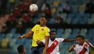 Colombia's Yerry Mina in action with Peru's Christian Ramos Reuters/Diego Vara