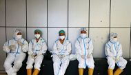 Healthcare workers wearing personal protective equipment (PPE) get ready to treat patients at the emergency hospital for the coronavirus disease (COVID-19), in Jakarta, Indonesia, June 17, 2021. REUTERS/Ajeng Dinar Ulfiana/File Photo
