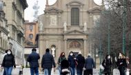 People walk at a street a year after the peak of Italy's coronavirus disease (COVID-19) outbreak, in Bergamo, the country's epicentre, Italy, March 3, 2021. REUTERS/Flavio Lo Scalzo/File Photo