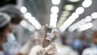 A health worker prepares a dose of AstraZeneca COVID-19 vaccine against the coronavirus disease (COVID-19) at the Central Vaccination Center, inside the Bang Sue Grand Station, Thailand, June 21, 2021. REUTERS/Athit Perawongmetha