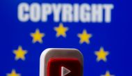 A 3D printed Youtube logo is seen in front of a displayed EU flag and copyright words in this illustration picture taken on June 21, 2021. REUTERS/Dado Ruvic/Illustration

