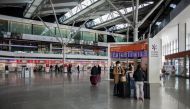 Passengers wearing face masks are seen at the terminal of Warsaw Chopin Airport following an outbreak of coronavirus disease in Warsaw, Poland, 13 March 2020. Dawid Zuchowicz/Agencja Gazeta/via REUTERS

