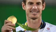 Gold medalist Andy Murray (GBR) of Britain reacts after receiving his medal. REUTERS/Toby Melville