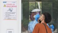 A medical worker conducts a rapid test for coronavirus disease (COVID-19) on a Taiwanese resident following an increasing number of locally transmitted cases at Songshan Airport in Taipei, Taiwan, June 2, 2021. Reuters/Ann Wang