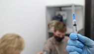 A healthcare worker prepares a dose of Sputnik V (Gam-COVID-Vac) vaccine against the coronavirus disease (COVID-19) at a vaccination centre for the Yandex Go drivers and couriers in Moscow, Russia June 24, 2021. REUTERS/Evgenia Novozhenina