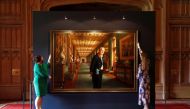 Members of the Royal Collection Trust staff pose for a photograph with the oil on canvas portrait, HRH The Prince Philip, Duke of Edinburgh, 2017, by Ralph Heimans, which forms part of the Prince Philip: A Celebration display in Windsor Castle, Britain, J