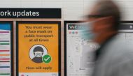 A sign at Central Station notes the implementation of new public health regulations from the state of New South Wales, as the city grapples with an outbreak of the coronavirus disease (COVID-19) in Sydney, Australia, June 23, 2021. REUTERS/Loren Elliott
