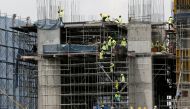 Labourers work at a construction site in downtown Bangkok, Thailand June 19, 2017. REUTERS/Chaiwat Subprasom/File Photo