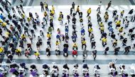 People wait to receive the second dose of Sinovac's COVID-19 vaccine against the coronavirus disease (COVID-19) at the Central Vaccination Center, inside the Bang Sue Grand Station, Thailand, June 21, 2021. REUTERS/Athit Perawongmetha