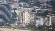 Aerial view shows the partially collapsed residential building in Surfside near Miami Beach, Florida, U.S. June 27, 2021. REUTERS/Marco Bello
