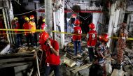 Rescue workers work at the site after a blast in a shop that killed several people in Dhaka, Bangladesh, June 27, 2021. REUTERS/Mhammad Ponir Hossain
