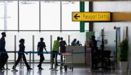 Security officers are seen at the passport control point at the Nnamdi Azikiwe international airport in Abuja, Nigeria September 7, 2020. REUTERS/Afolabi Sotunde/File Photo

