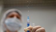 A healthcare worker prepares a dose of Sputnik V (Gam-COVID-Vac) vaccine against the coronavirus disease (COVID-19) in a vaccination centre at a shopping mall in Omsk, Russia, June 29, 2021. REUTERS/Alexey Malgavko