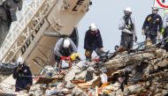 Emergency workers conduct search and rescue efforts at the site of a partially collapsed residential building in Surfside, near Miami Beach, Florida, U.S. June 30, 2021. REUTERS/Joe Skipper