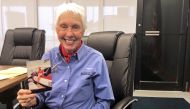 FILE PHOTO: Wally Funk, a Virgin Galactic ticketholder and one of the First Lady Astronaut Trainees or ‘Mercury 13’ women, is pictured holding a photo of herself at the International Women’s Air and Space Museum in Cleveland, Ohio, U.S. March 29, 2019. RE