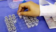 A medical worker holds a Sinovac coronavirus disease (COVID-19) vaccine container as the Thai resort island of Phuket rushes to vaccinate its population amid the COVID-19 outbreak ahead of a July 1 end of strict quarantine for overseas visitors to bring b