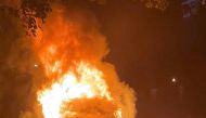 Tesla Inc's new Model S Plaid electric car is seen in flames in Pennsylvania, U.S., in this handout photo provided to Reuters on July 2, 2021. According to an attorney for the driver, the car went into flames while the owner was driving it on Tuesday, thr