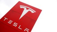 File photo: The logo of car manufacturer Tesla is seen at a dealership in London, Britain, May 14, 2021. Reuters/Matthew Childs/File Photo
