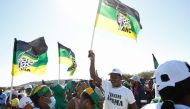 Supporters of former South African President Jacob Zuma, who was sentenced to a 15-month imprisonment by the Constitutional Court, sing and dance in front of his home in Nkandla, South Africa, July 3, 2021. (Reuters/Rogan Ward)