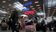 Passengers line up to check in inside the Terminal 3 at Orly Airport, near Paris, France, July 1, 2021. REUTERS/Sarah Meyssonnier