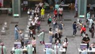 People wait to receive a dose of the Moderna vaccine against the coronavirus disease (COVID-19) at the National Taiwan Science Education Center in Taipei City, Taiwan July 3, 2021. REUTERS/Ann Wang
