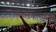 FILE PHOTO: Wembley Stadium, London, Britain - June 29, 2021 England fan celebrates during the match Pool via REUTERS/Matthew Childs/File Photo
