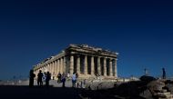 FILE PHOTO: People visit the Parthenon temple atop the Acropolis hill in Athens, Greece, June 8, 2021. Picture taken June 8, 2021. REUTERS/Alkis Konstantinidis/File Photo

