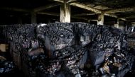 Burnt bottles are seen after a fire broke out at Hashem Foods Ltd factory, in Rupganj, Narayanganj district, on the outskirts of Dhaka, Bangladesh, July 10, 2021. (REUTERS/Mohammad Ponir Hossain)