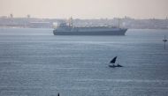 FILE PHOTO: A ship is seen after passing through the Suez Canal in Ismailia, Egypt March 25, 2021. REUTERS/Amr Abdallah Dalsh
