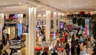 FILE PHOTO: People wearing protective masks shop at Macy's Herald Square following the outbreak of COVID-19 in New York City, December 26, 2020 JEENAH MOON/REUTERS