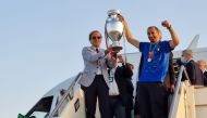 taly coach Roberto Mancini and captain Giorgio Chiellini walk down steps of a plane holding the Euro 2020 cup at Fiumicino airport near Rome, Italy, July 12, 2021.