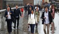 Commuters cross the London Bridge, amid the spread of the coronavirus disease (COVID-19), in London, Britain July 6, 2021. REUTERS/Hannah McKay
