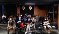 People sit after they received a coronavirus disease (COVID-19) vaccine as the country extends vaccination to curb surge among population under 30, in Madrid, Spain, July 12, 2021. REUTERS/Javier Barbancho

