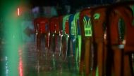 Plastic chairs, for people who come to queue overnight for a free coronavirus disease (COVID-19) test, are seen in the rain, at a temple in Bangkok, Thailand July 10, 2021. REUTERS/Soe Zeya Tun/File Photo