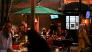 People eat in a restaurant as the coronavirus disease (COVID-19) outbreak continues in Mexico City, Mexico July 9, 2021. REUTERS/Edgard Garrido
