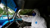 Sunaryo drives an ambulance as he delivers a patient suffering from coronavirus disease (COVID-19), as cases surge in Depok, on the outskirts of Jakarta, Indonesia, July 13, 2021. REUTERS/Ajeng Dinar Ulfiana