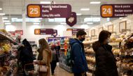 FILE PHOTO: Shoppers look at bread in a Sainsbury's supermarket, amid the coronavirus disease (COVID-19) outbreak, in London, Britain January 12, 2021. REUTERS/Henry Nicholls/File Photo
