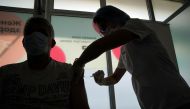 A man receives a dose of Sputnik V (Gam-COVID-Vac) vaccine against the coronavirus disease (COVID-19) in Moscow, Russia July 15, 2021. REUTERS/Tatyana Makeyeva