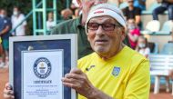The world's oldest tennis player Ukrainian Leonid Stanislavskyi, 97, takes part in an award ceremony of the Guinness World Record certificate in Kharkiv, Ukraine July 7, 2021. Picture taken July 7, 2021. REUTERS/Vyacheslav Madiyevskyy