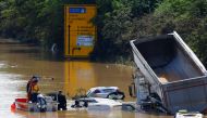 Divers from German Life Saving Association (DLRG) search at a flooded road following heavy rainfalls in Erftstadt-Blessem, Germany, July 17, 2021. (REUTERS/Thilo Schmuelgen)