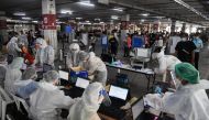 People queue for free coronavirus disease (COVID-19) rapid antigen tests at a mass testing station, as the spread of COVID-19 continues, in Bangkok, Thailand, July 15, 2021. REUTERS/Chalinee Thirasupa