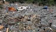 Trash, including bottles and barrels, is pictured following heavy rainfalls in Bad Neuenahr-Ahrweiler, Germany, July 18, 2021. REUTERS/Wolfgang Rattay