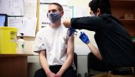 A person receives a dose of the Pfizer BioNTech vaccine, at vaccination centre for young people and students at the Hunter Street Health Centre, amid the coronavirus disease (COVID-19) outbreak, in London, Britain, June 5, 2021. REUTERS/Henry Nicholls/Fil