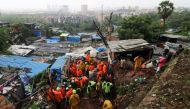Rescue workers search for survivors after a residential house collapsed due to landslide caused by heavy rainfall in Mumbai, India, July 18, 2021. REUTERS/Niharika Kulkarni/File Photo