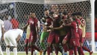 Qatar midfielder Abdelaziz Hatim (6) celebrates his goal with teammates against Honduras in the second half during a CONCACAF Gold Cup group stage soccer match at BBVA Stadium.   Thomas Shea
