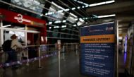 An advisory encouraging people to maintain social distancing and weara a protective face mask is seen, after the government allowed domestic flight services to resume from coming Monday, during an extended nationwide lockdown to slow the spread of the cor